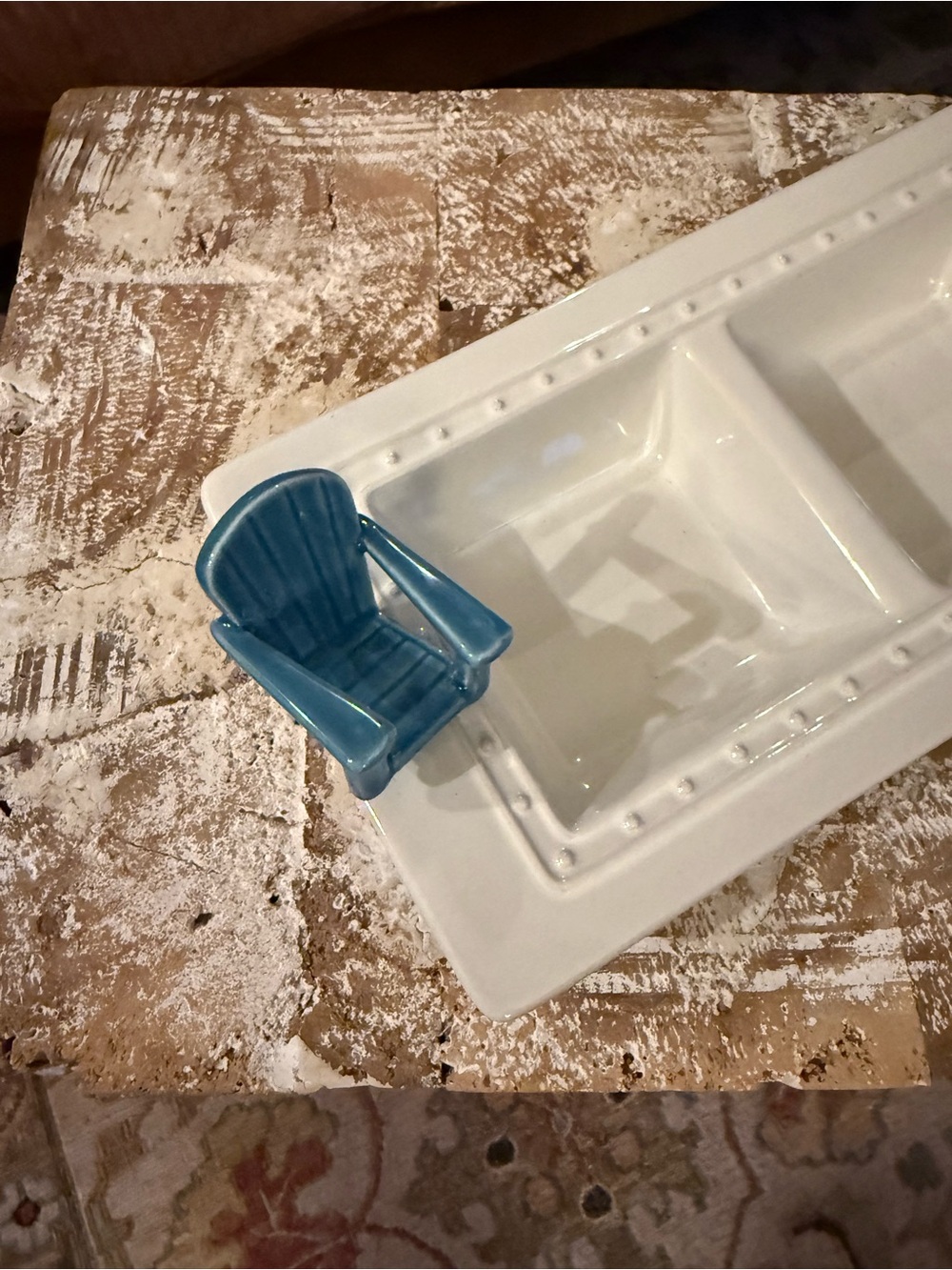 Nora Fleming relish tray with beach chair ornament.